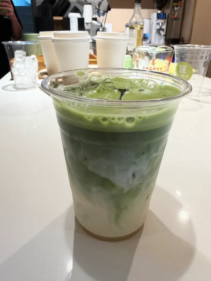 Layered iced matcha latte at Sora Bake & Tea Room Calgary