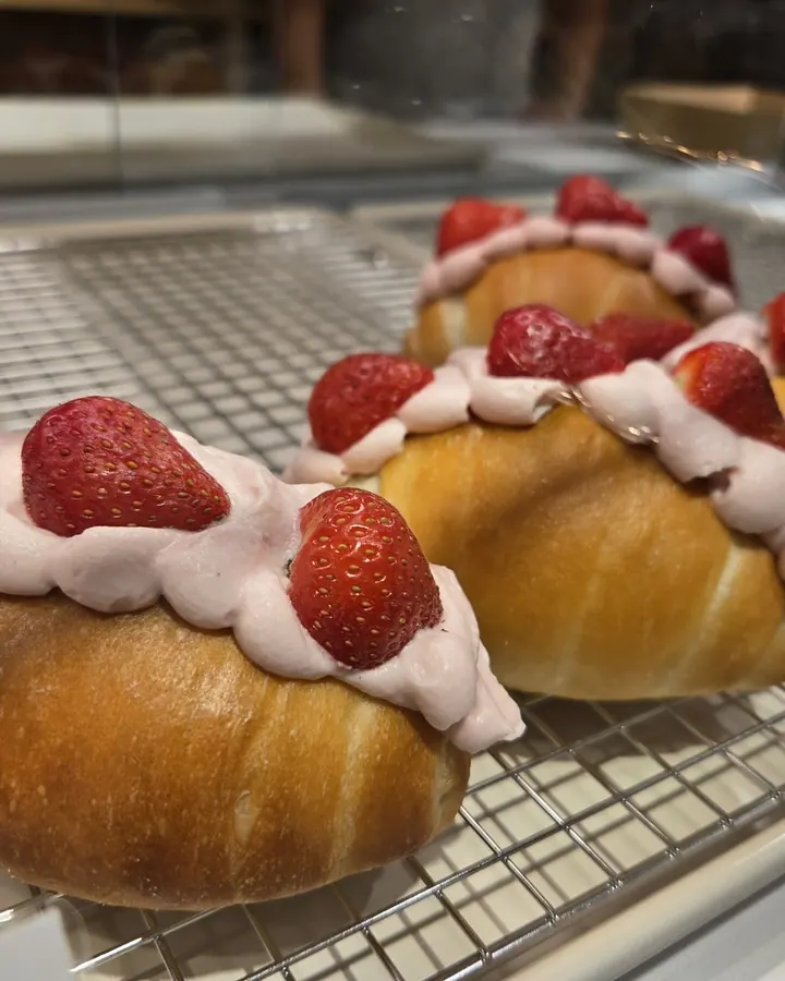 Salt bread topped with strawberry cream and fresh strawberries at Sora